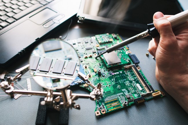 bigstock-Technician-Repair-soldering-I-110997497-650x433
